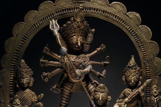 Cast brass figure of the Hindu goddess Durga as Mahishasura slaying the buffalo demon Mahisha.